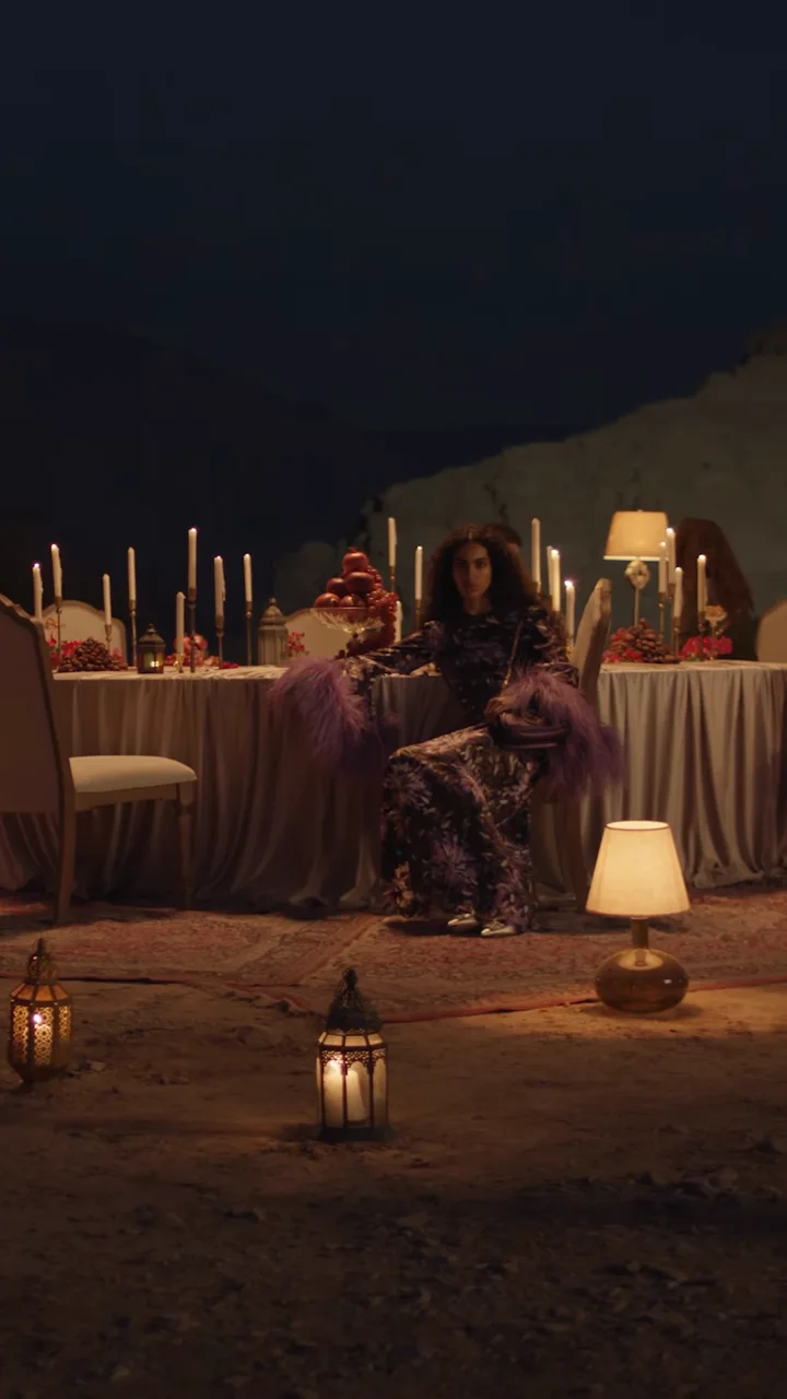 Gucci Nojum: a candlelit table and lamps on the desert set at Jebel Jais
