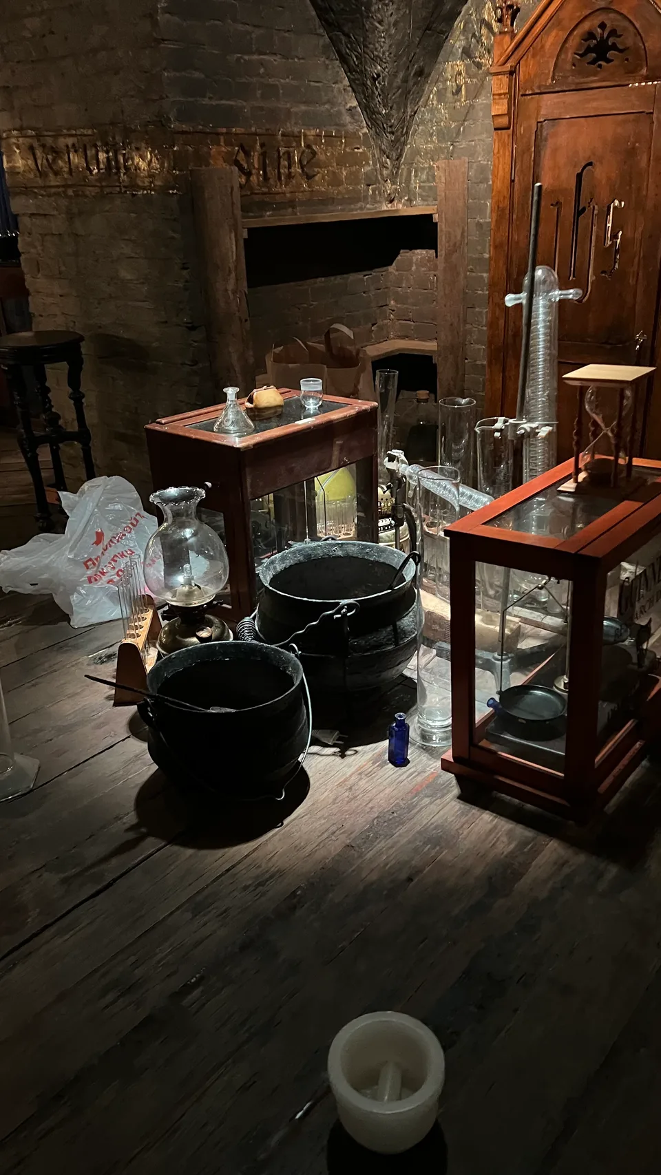Behind the scenes: vessels, a chair and tabletop props being arranged in the existing ornate interior.