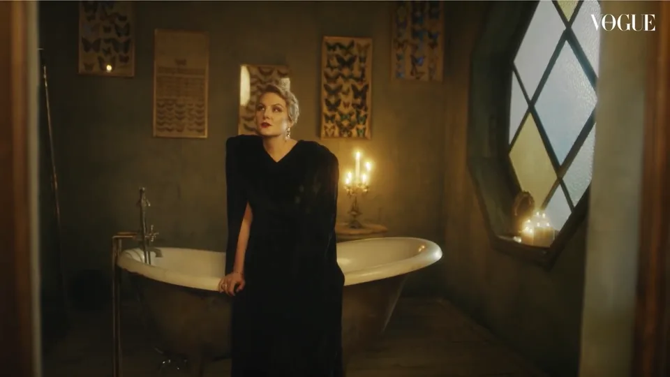A Vogue film frame showing a freestanding bath and patterned window.