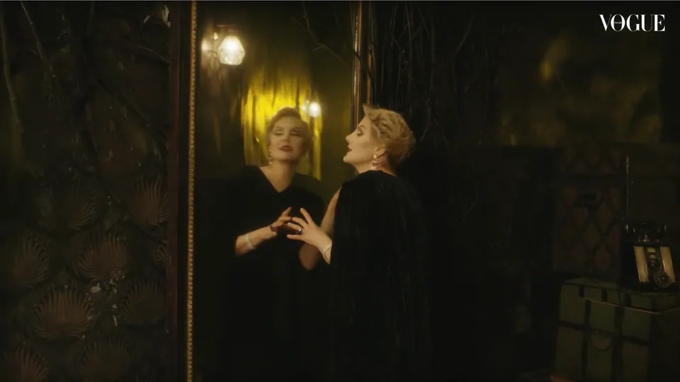 A Vogue film frame showing the interview in a mirrored interior.